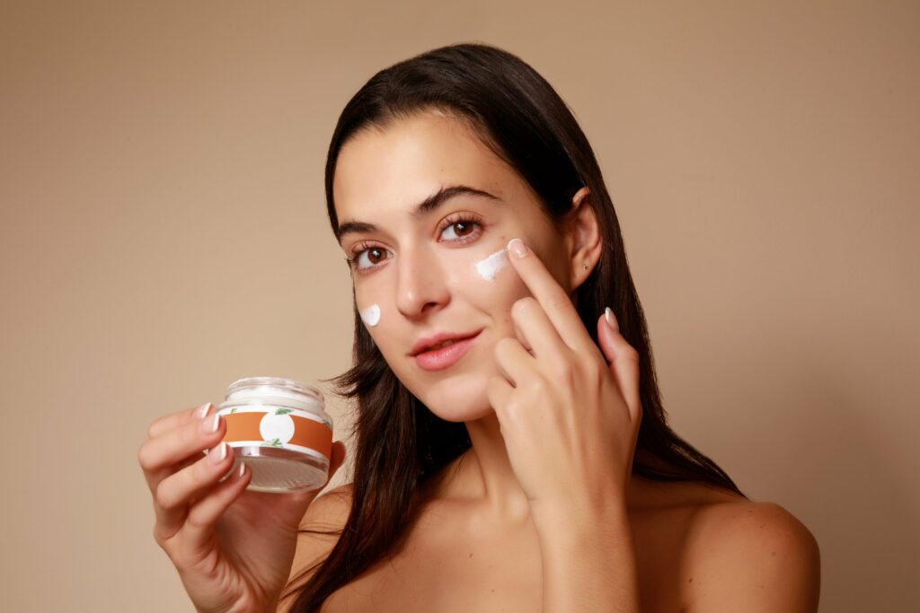 Girl applying facial cream | Moxie Medspa in Blackfoot
